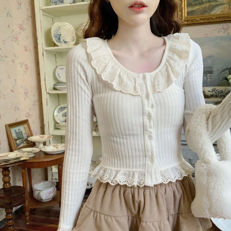 Longsleeved Blouse With Ruffled Neck And Hem