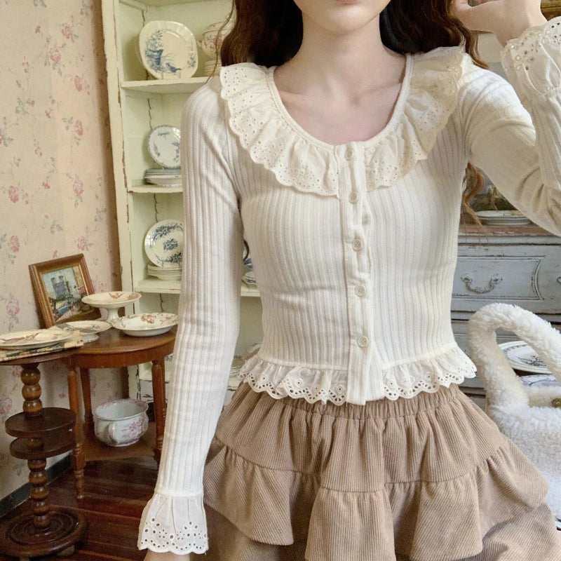 Longsleeved Blouse With Ruffled Neck And Hem