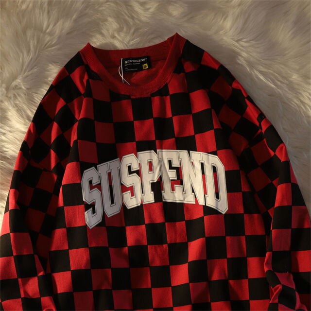 "SUSPEND" Checkered Sweater
